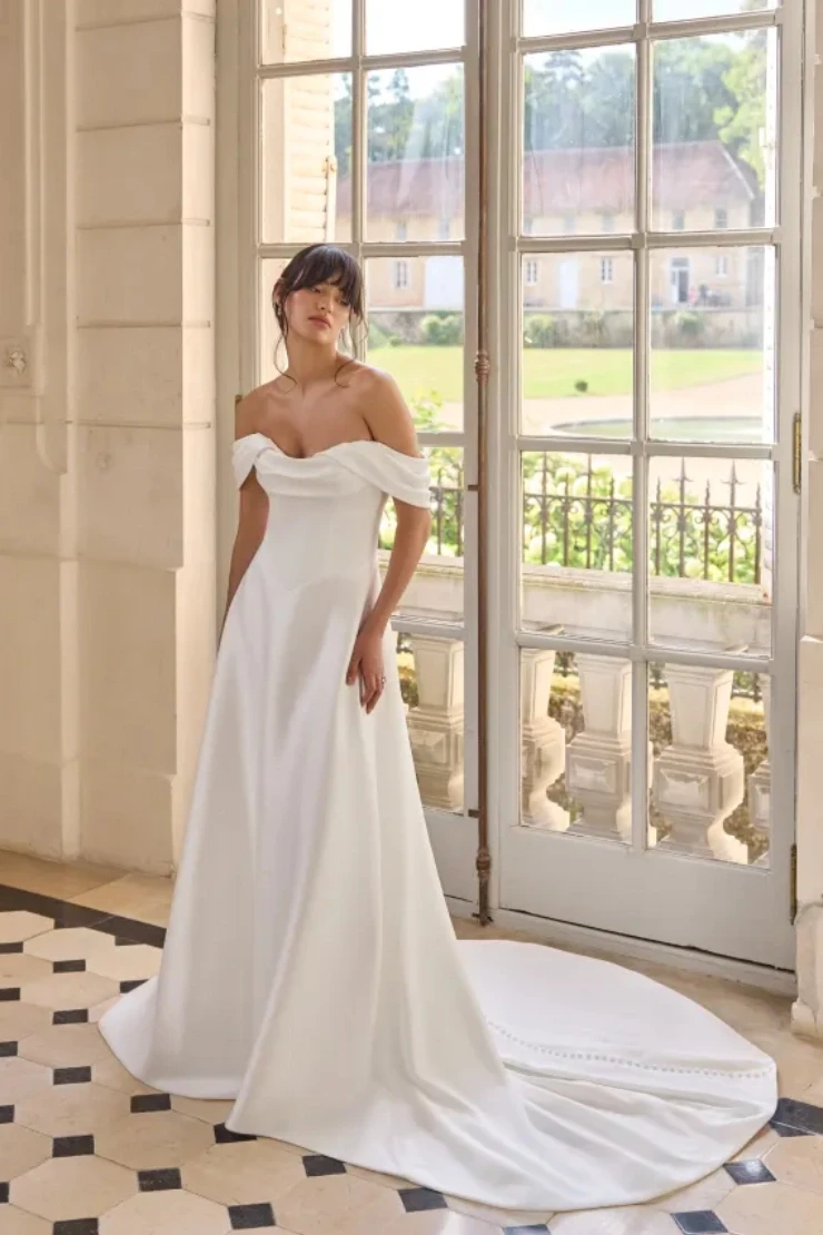 Model wearing white Adore Bridal dress
